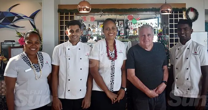 (Second from right) Retired Judge Paul Madigan with staff of the Tanoa Waterfront Hotel in Lautoka on December 6 .Photo: Salote Qalubau.