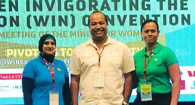 The Executive Manager, Digital Channels and Tourisms Partnerships Fiji, Akuila Batiweti in the centre. On the left is Shilfa Tusheen from Investment Fiji and on the right - Ema Lagilevu, Senior Legal Officer, Fiji Development Bank. The ladies a surprise prize at the convention.