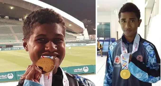 Vasemaca Nahehe and Robert Rabaka with their gold medal. Photo: Fiji Special Olympics