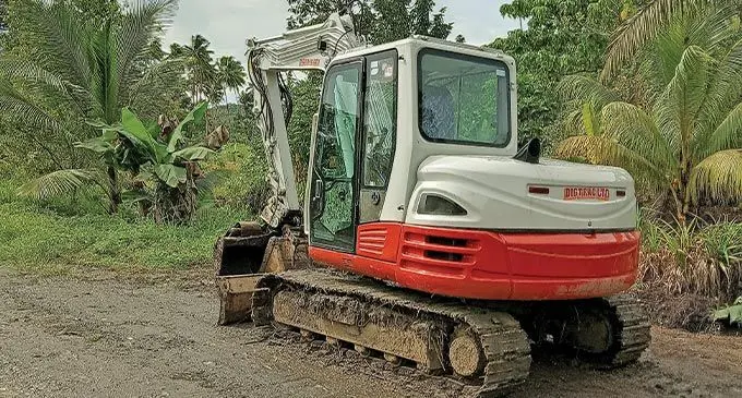 Road machine parks, before they start another day of road works.