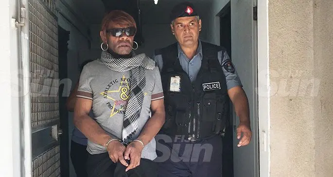 Josevata Werelagi is escorted by a Police officer outside the High Court in Suva on December 9, 2019. Photo: Ashna Kumar