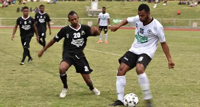 Suva’s central defender Waisake Navunigasau (right) defends against Shazil Ali of Ba during the INKK Mobile Battle of the Giants clash at Churchill Park, Lautoka, on August 4, 2019.  Photo: Waisea Nasokia