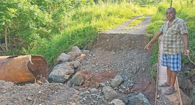 Dalip Chand looking at what’s left of the crossing in Lomaloma Settlement in Labasa on March 23, 2024. . Photo: Shratika Naidu