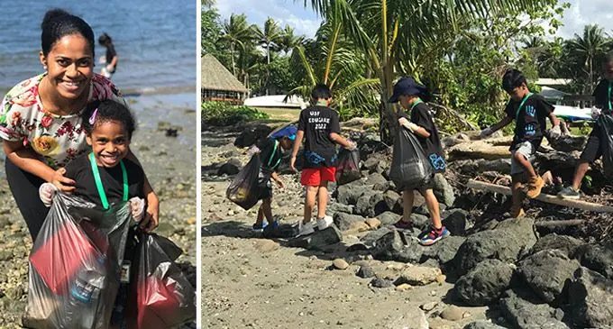 From  (R) -Five year old Torika Deiloa with Postgraduate Marine science student Savaira Rayawa  during the cleanup campaign at USP lower campus beachfront. (L)- Picking up rubbish by USP Educare Centre preschoolers. Photo: Kelera Sovasiga-Tuisawau