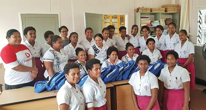 Adi Cakobau School ex-scholars with the 17 students whose belongings were destroyed earlier this week.