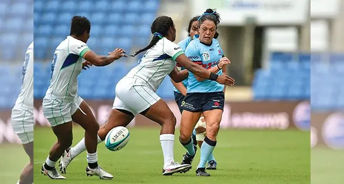 Iliseva Batibasaga (right) putting through a kick during the Waratahs’ loss to the Rooster Chiken Fijiana Drua in Round Four. Photo: Sydney Morning Herald