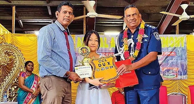 Central College dux Ruth Wang, with school principal, Amant Lal (left) and Deputy Commissioner of Police, Itendra Nair, following the school’s annual awards ceremony. Photo: Central College
