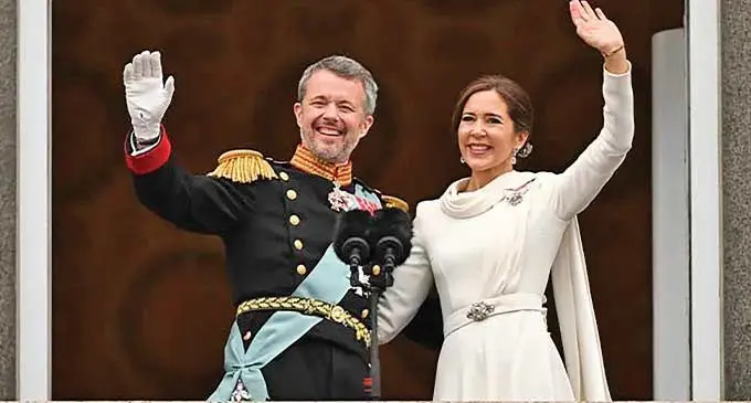 King Frederik X of Denmark and his wife Queen Mary greet crowds from the balcony of Christiansborg Palace in Copenhagen, Denmark.