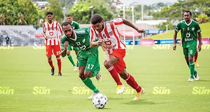 Labasa’s Nemani Dolodai runs away from Nadi defender Serevi Waqa during their Digicel Premiere League match at the ANZ Stadium in Suva on December 6, 2021. Photo: Leon Lord