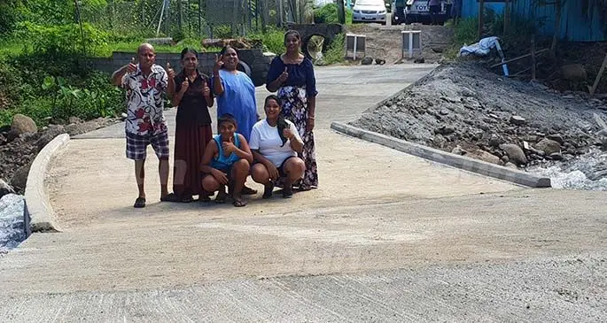 Back row, from left: Qaliwalu Settlement residents, Vinod Kumar, Dharna Wati, Premila Wati and Reena Devi with (front row) Anjali Kumar and Aryan Kumar on the newly-constructed Bridge at Kalacraft, Lautoka on February 20, 2021. Photos: Nicolette Chambers