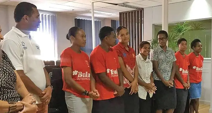 Lillian Amazons coach Tihrani Uluinakauvadra (first from left) with members of the team at the Bula Outsourcing headquarters in Suva on April 14, 2022. Photo: Bula Outsourcing
