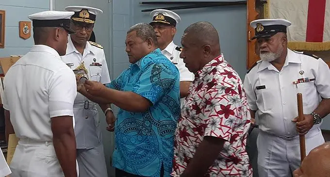 RFMF Commander Rear Admiral Viliame Naupoto, second left gave  Taraiasi Vuetanasau (uncle), and Solomone Tuinasau (step father) the honour to commission Ensign Sitiveni Sokotiviti. Photo: Shreeya Verma