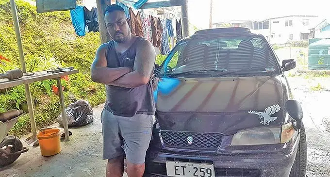 Nitesh Prasad of Nausori with his car that was driven from his home. 
