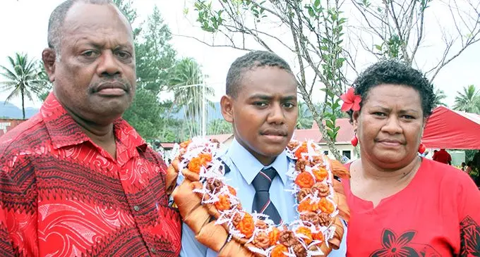 Vilomena Niulele flanked by her parents father Aborosio Keretabua (left), and mother Teresia Keretabua after the National Fire Authority passing-out parade at the naval base in Togalevu, outside Lami, on August 22, 2019.  Photo: Simione Haravanua