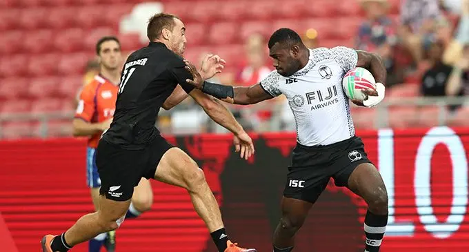 Fiji's Asaeli Tuivuaka fends off New Zealand's Joe Webber on day two of the HSBC World Rugby Sevens Series in Singapore on 14 April, 2019. Photo credit: Mike Lee - KLC fotos for World Rugby