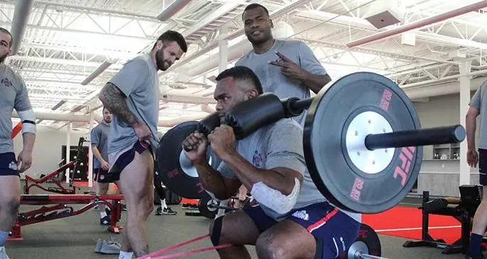 Former Flying Fijians flanker Naulia Dawai (on weights) and Poasa Waqanibau training at their New England Free Jacks club.. Photo: MLR