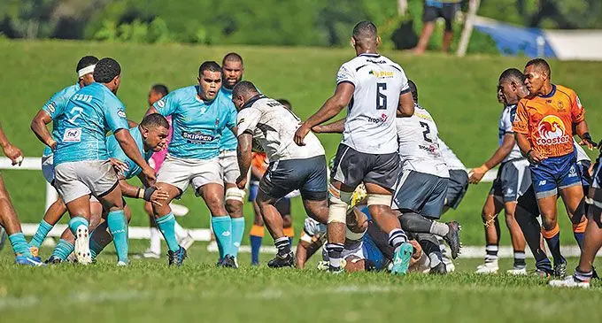A Nadroga forward tries to break through the Suva defense at Lawaqa, Park in Sigatoka.