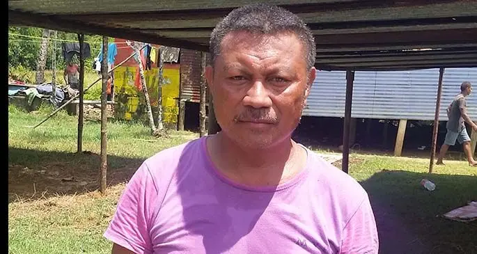 Viliame Sigavata at Vuniivi Settlement. Behind him is the make-shift shed where a birthday celebration will be hosted. Photo: Maika Bolatiki