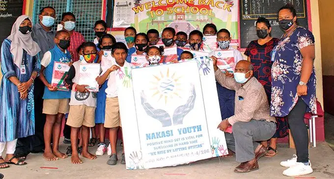 Members of the Nakasi Youth Club with the staff and students of Nalovo Sangam School in Nadi.