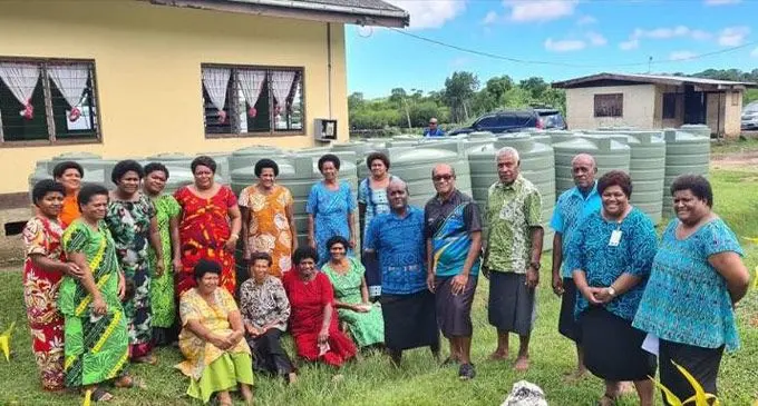 Minister for Infrastructure and Meteorological Services and Minister for Lands and Mineral Resources, Jone Usamate (fifth from right), the Water Authority of Fiji team and villagers of Naisausau in Tailevu after the handover. Photo: Water Authority of Fiji