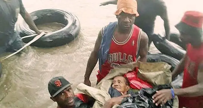 Members of the rescue team assemble rubber tubes to help float the 62-year-old woman across the Ba River to the Nacaci School on February 6, 2022 in Toge village, Ba. Photo: Jonacani Vuturo Yabaki.