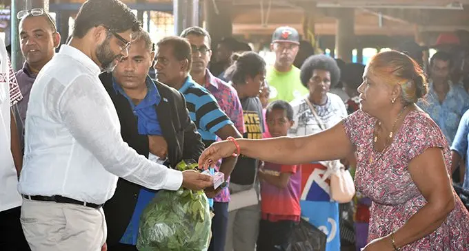 Minister for Economy Aiyaz Sayed-Khaiyum receives his change from a Labasa market vendor on March 2,2019. Photo: Laisa Lui