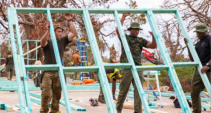 Members of the Australian Army and the Republic of Fiji Military Forces during the rebuilding efforts in the Northern Division. Photos: Australian Defence Force
