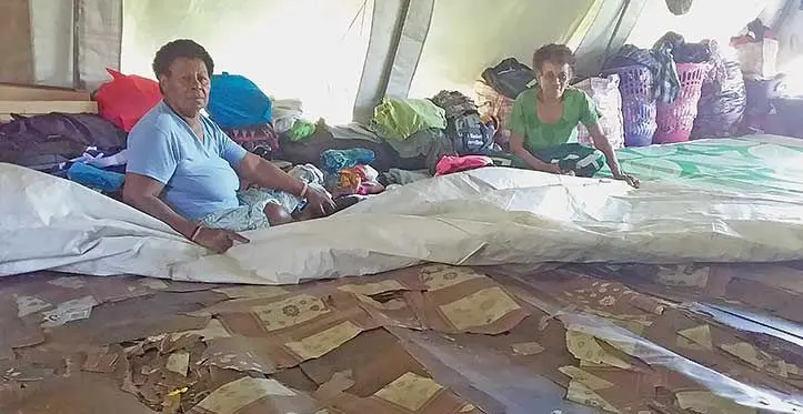 Laisani Matiavi (green) showing the deplorable floor at their makeshift tent at Savadrua Assemblies of God Church compound on September 5, 2023. Photo: Jone Salusalu