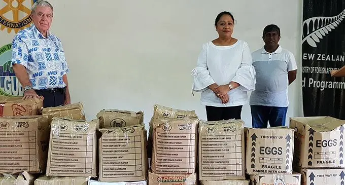 Minister for Local Government, Housing and Community Development Premila Kumar (middle), handing over the cartons of food rations to the founder of the Koroipita Model Town, Peter Drysdale (left) on June 20, 2020. Photo: Nicolette Chambers
