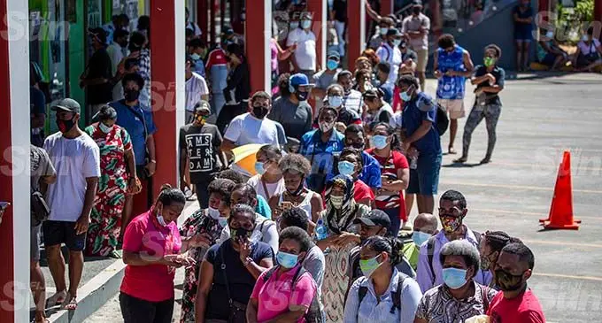 Fijians line up in front of the Vodafone outlet at Damodar City on August 23, 2021 Photo: Leon Lord
