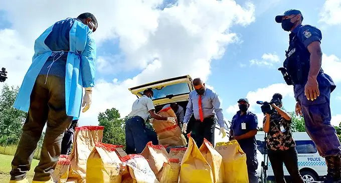 Police officers while burning and disposing AU$33 million worth of cocaine at Nakasi, Nausori on July 28, 2022 Photo: Ronald Kuma