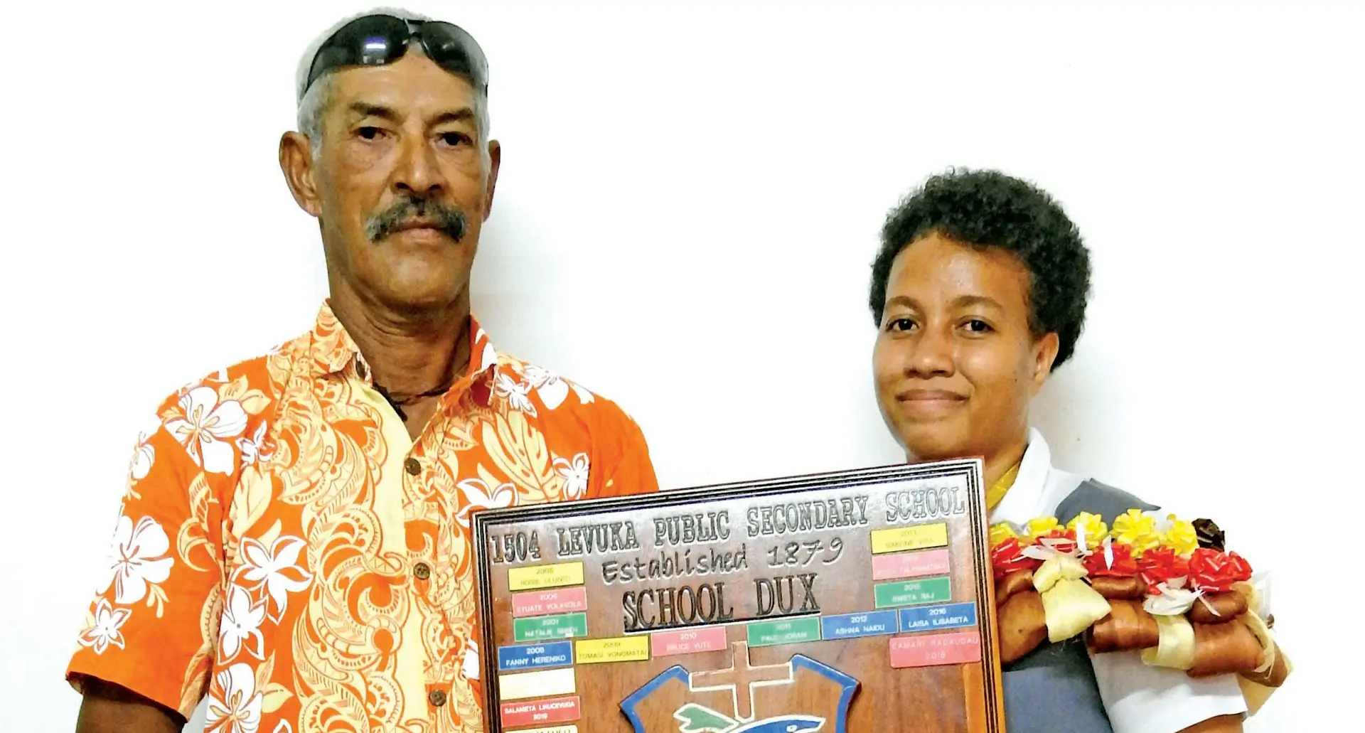Keverieli Salesi (father) with Levuka Public School dux Teresia Loco and her award. Photo: Manhar Vithal