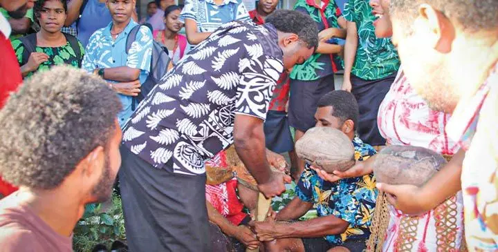 Fiji National University students participating in coconut husking as they celebrate Ratu Sukuna Day on May 29, 2025.