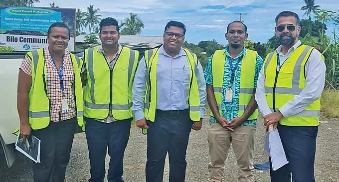Water Authority of Fiji chief executive officer Amit Chanan (right) with his team at Bila Settlement, Lami. Photo: WAF