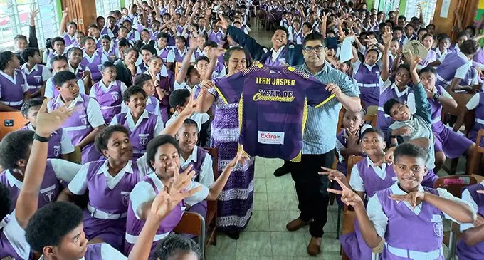 Vanita Kumar (left) and Extra Supermarket operations manager, Ravinesh Deo shows the sponsored athletes uniforms for the Coca-Cola Games at the school in Lautoka on August 16, 2022. Photo: Nicolette Chambers 