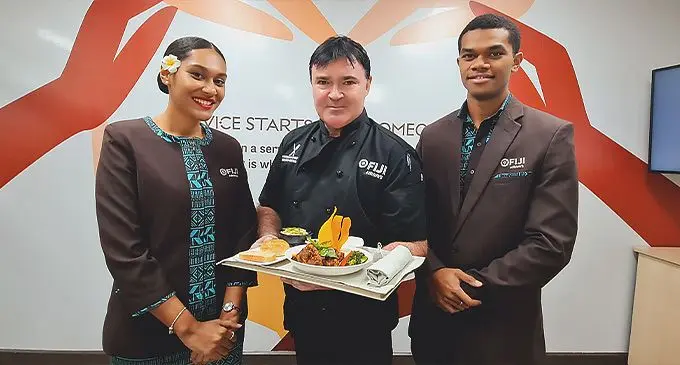 Fiji Airways Executive Chef Richad Cross with Fiji Airways Cabin Crew, Lusiana and Waisea. Photo: Fiji Airways