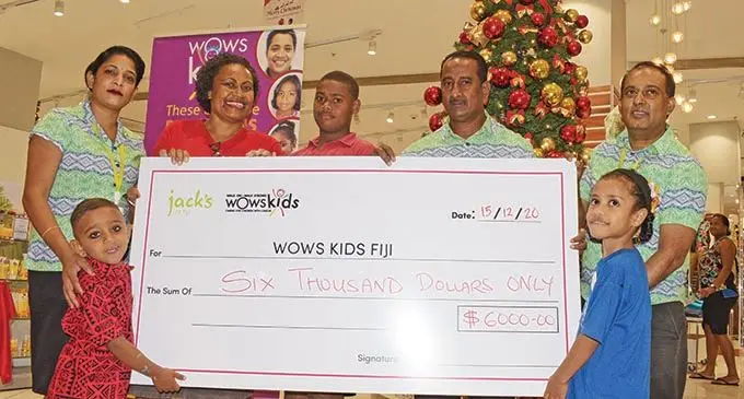 Jack’s of Fiji regional manager central Madan Krishna (fifth from left), with staff Mohammed Salim and Anita Deo handing over the donation to WOWS Kids Fiji team leader, Mere Williams, and children Rishav Lal, Abele Navecena and Avolonia Draiva at Jack’s MHCC shop on December 15, 2020.    Photo: Ronald Kumar