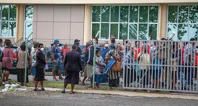 Sureties and family member of the alleged Nabua brawlers waiting outside the Fiji Police Force Academy in Nasova, Suva on October 11, 2021. Photo: Leon Lord