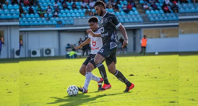 Suva FC’s Inoke Turagalailai and Ba’s Saula Waqa tussle for possession in their Digicel Fiji FACT football Round 1 match at the ANZ Stadium in Suva on May 22, 2022. Suva won 1-0. Photo: Leon Lord