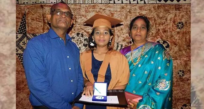 Shayal Shivani, with her parents Mukesh Chand and Sunil Lata, showing her award.