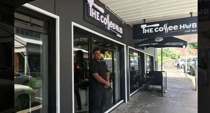 Coffee Hub staff Kolinio Cavu infront of the new Suva outlet. Photo: Coffee Hub