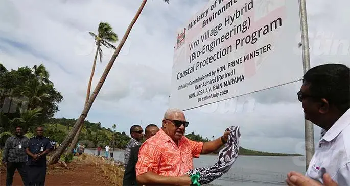 Prime Minister Voreqe Bainimarama commissions the Viro Village Hybrid (Bio-Engineering) Coastal Protection Programme at the village in Ovalau on July 15, 2020. He is accompanied by Minister for Waterways and Environment Mahendra Reddy (right). Photo: Kelera Sovasiga