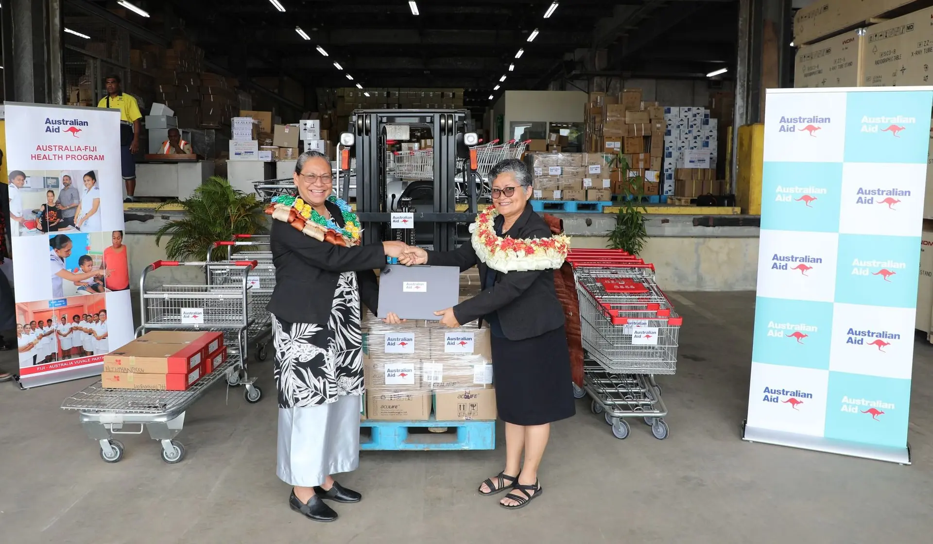 Chief medical advisor Dr Luisa Cikamatana receives the donation from DFAT senior programme manager for Health, Dr Frances Bingwor in Suva.