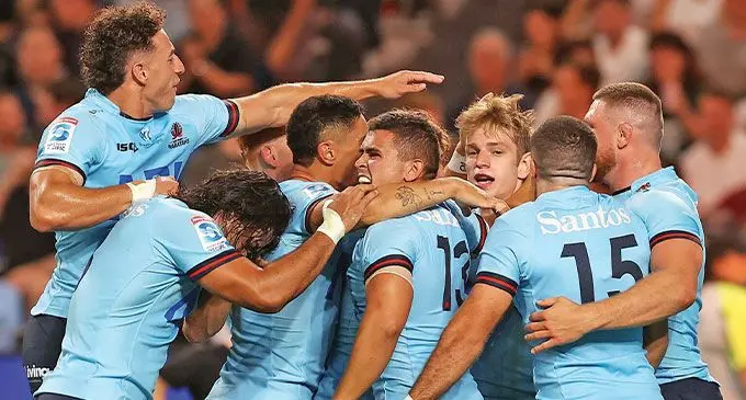 Mark Nawaqanitawase (left) and his Waratahs teammates celebrate Max Jorgensen’s try against Brumbies on February 24, 2023.