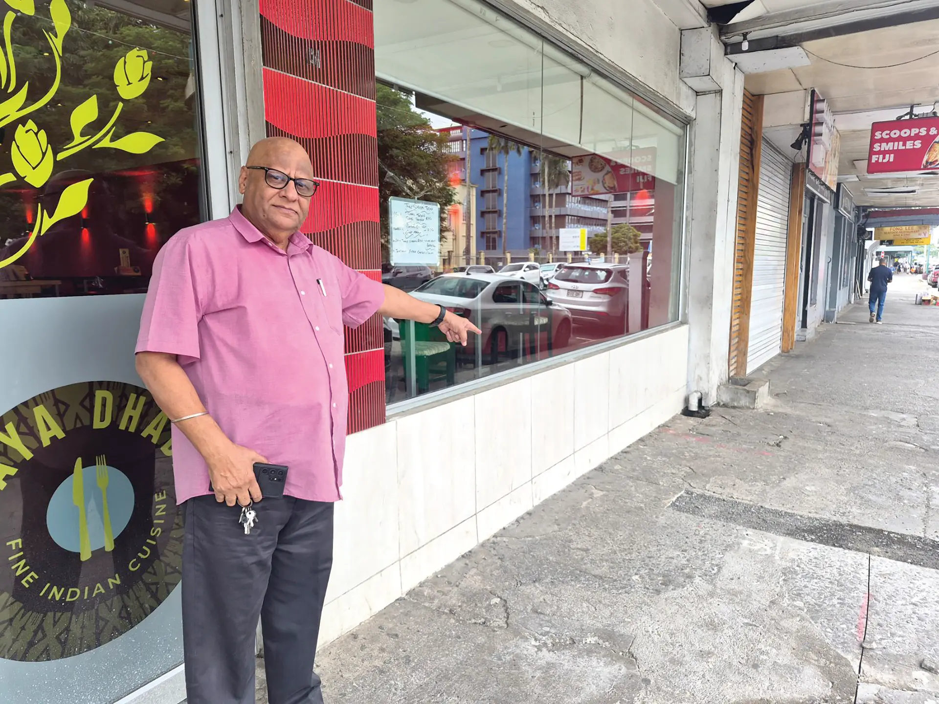 Maya Dhaba Restaurant director Harminder Singh points at the spot in front of his Suva restaurant where beggars usually sit.