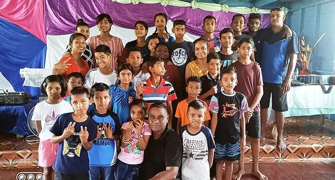 Victory Christian Fellowship church pastor, Samuel Jeet, with children and youths during the Fun Day at their premises in Volovi, Labasa on November 5, 2022.