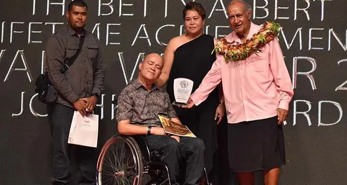 Speaker of Parliament Ratu Epeli Nailatikau presents Joshko Wakaniyasi with the Lifetime Achievement Award during the HomeCare Independent National Disability Awards at the National Gymnasium on March 27, 2021. Photo: Parliament of Fiji