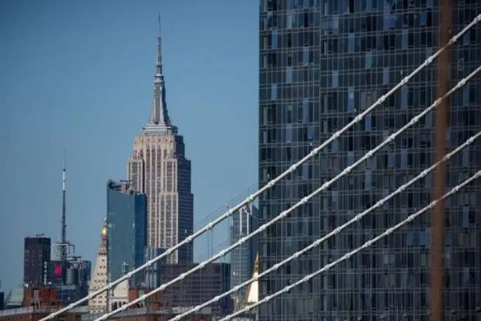 The Empire State building is seen from the Brooklyn Bridge in New York, the United States, on March 27, 2020. (Photo by Michael Nagle/Xinhua)