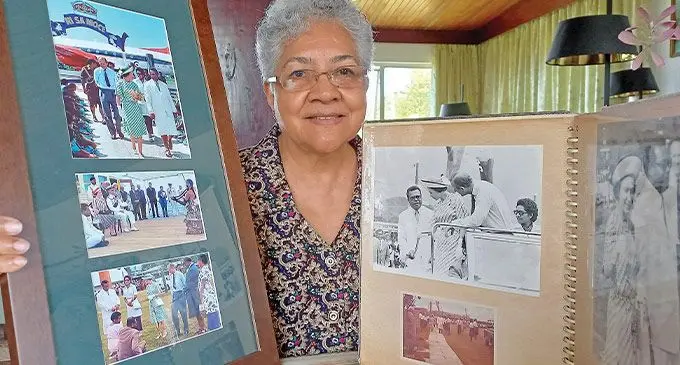 Sofi Kanaimawai with pictures of Queen Elizabeth II’s Royal visit to Suva and Labasa, which she was part of in 1977. Photo: Ronald Kumar