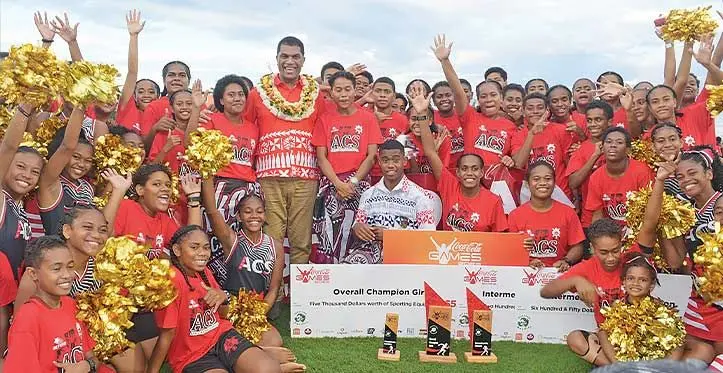 Minister for Education Aseri Radrodro with Adi Cakobau School athletes and supporters after retaining the girl’s title of the Coca-Cola Games at the HFC Bank Stadium in Suva on April 29, 2023. Photo: Ronald Kumar
